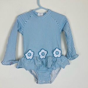 Classic Whimsy long sleeve blue and white seersucker swimsuit w/ daisy appliqué
